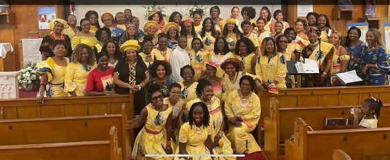 LESANs dressed in yellow at a church celebration