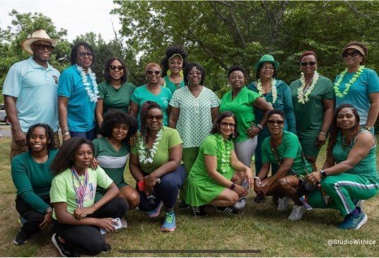 LESANs in green at an outdoor gathering